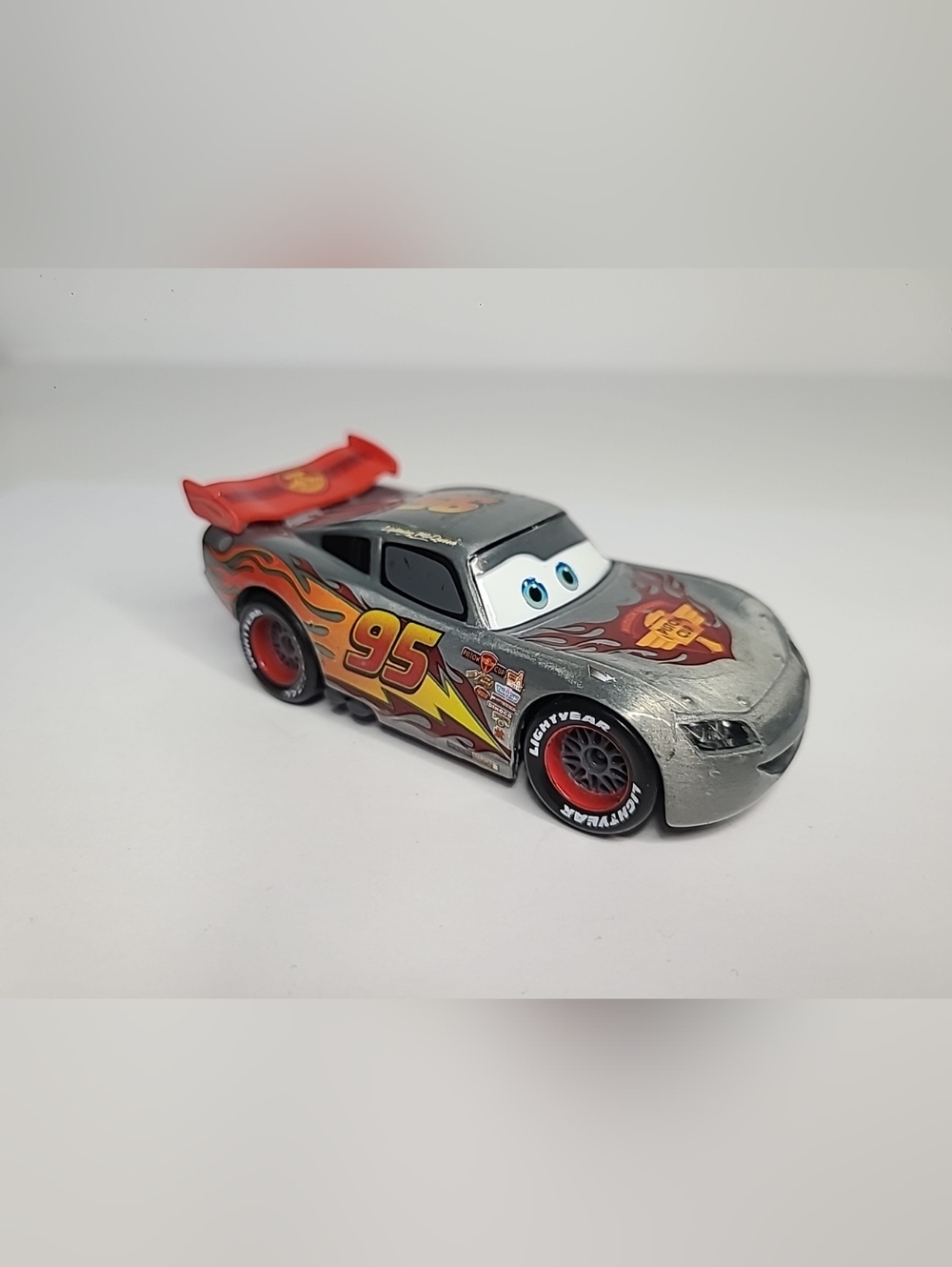 Disney Store Cars Silver Lightning McQueen Diecast Piston Cup Red Flames HTF